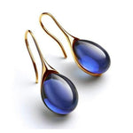 CristalLux Brincos Gota Ouro Prata - Elegância Brilhante - | Benedita Lisboa
